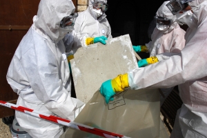 Asbestos Remediation - The professional ACM Removal team works together to remove contained asbestos.
